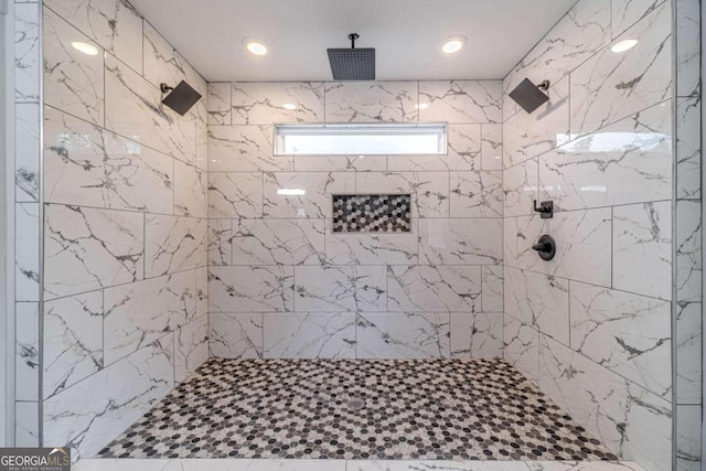 bathroom featuring a tile shower