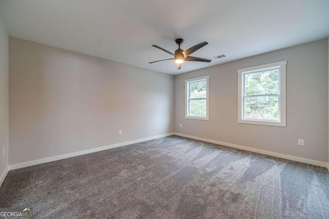 carpeted empty room with ceiling fan