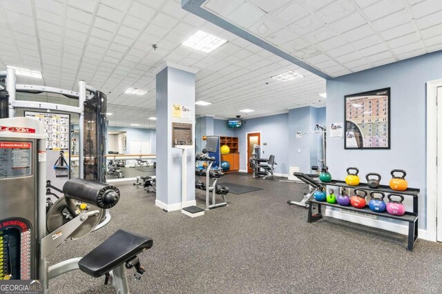 exercise room with a drop ceiling