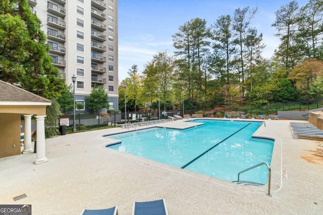 view of swimming pool featuring a patio