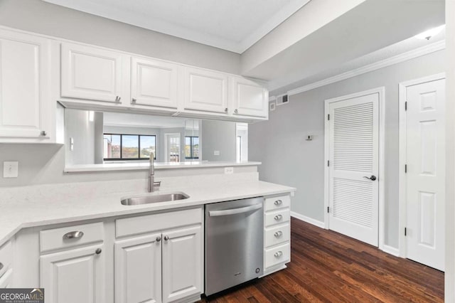 kitchen with stainless steel dishwasher, white cabinets, sink, and dark wood-type flooring