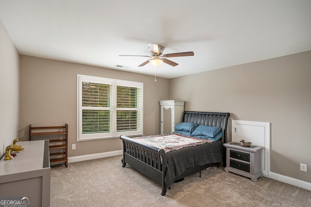 carpeted bedroom with ceiling fan