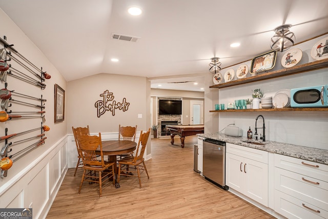 kitchen featuring white cabinetry, sink, decorative backsplash, and dishwasher