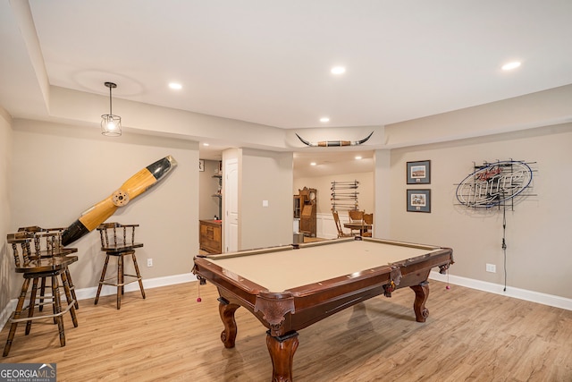 recreation room with billiards and light hardwood / wood-style flooring