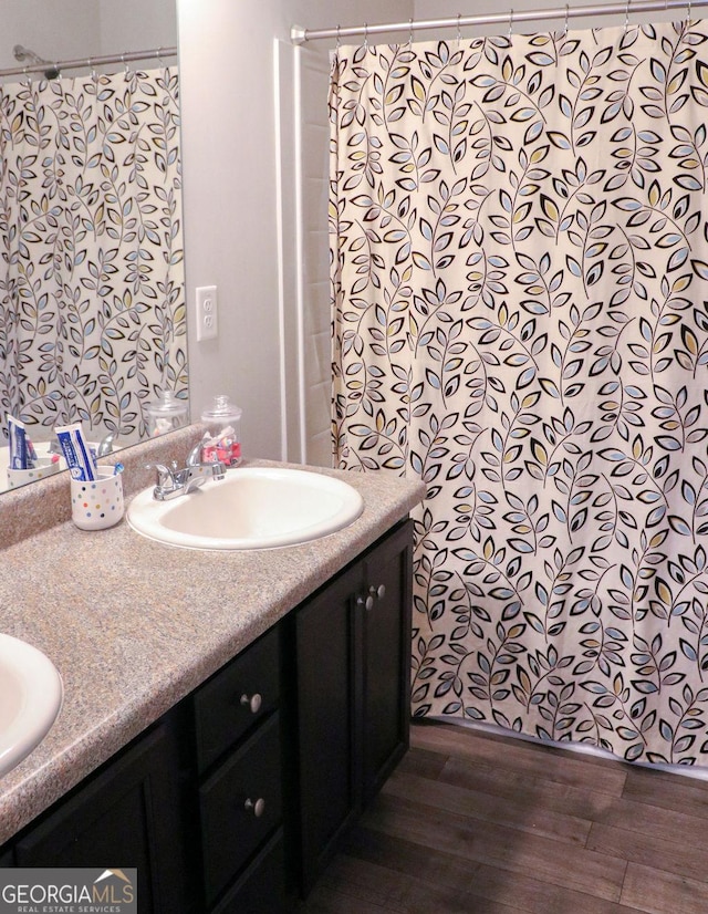 bathroom with vanity and hardwood / wood-style flooring