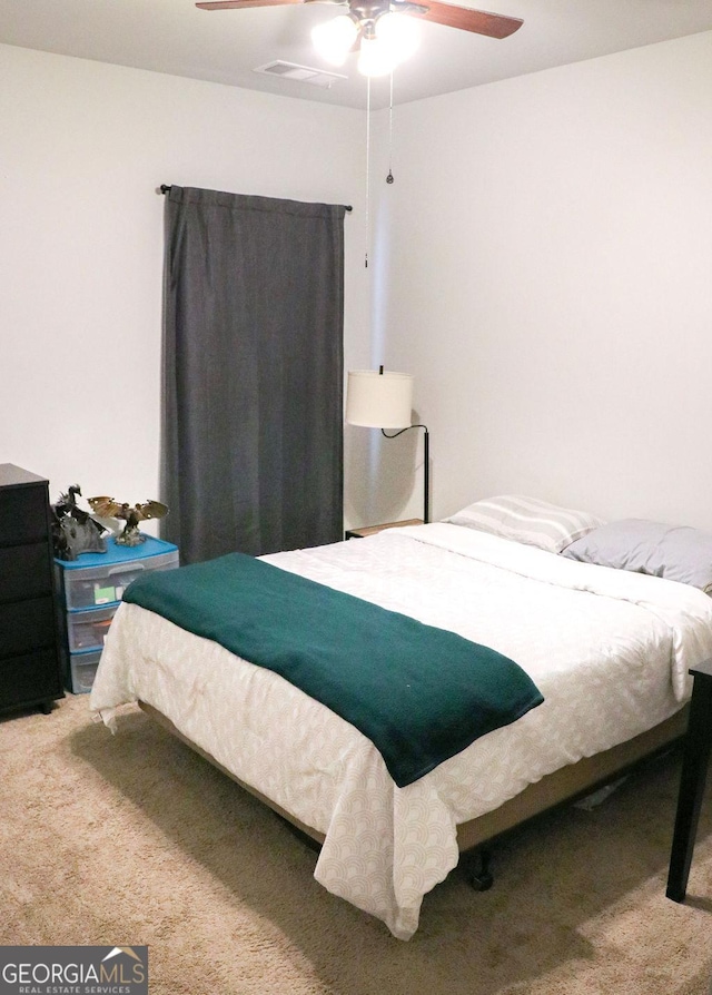 carpeted bedroom with ceiling fan