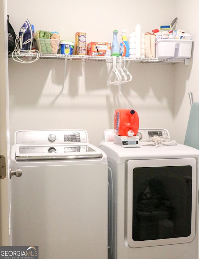 washroom with independent washer and dryer