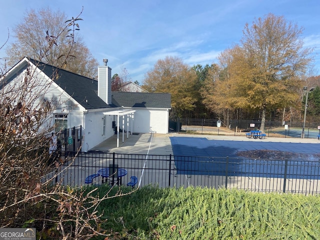 view of swimming pool with a patio