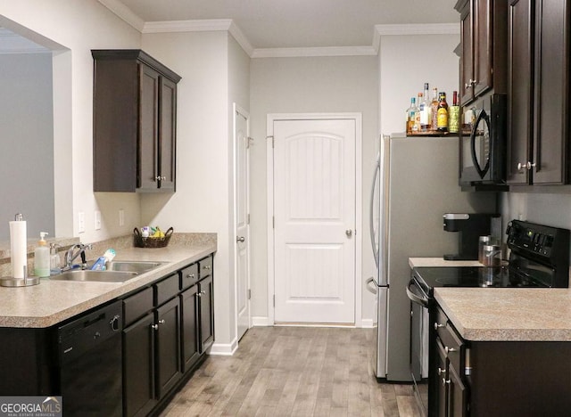 kitchen with black appliances, dark brown cabinets, light wood-type flooring, and ornamental molding