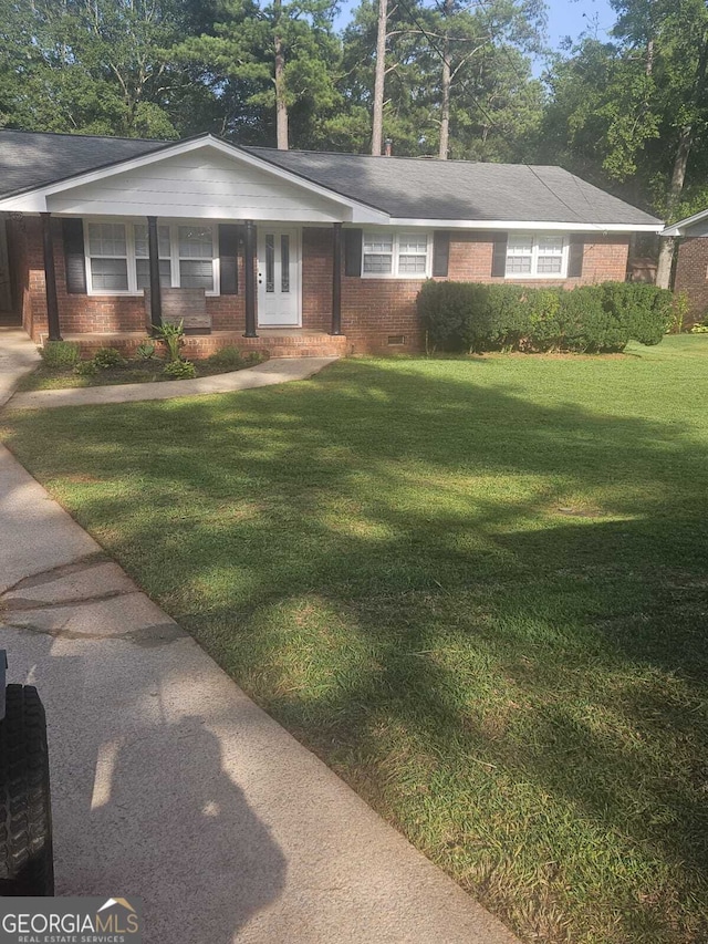 ranch-style house with a front lawn