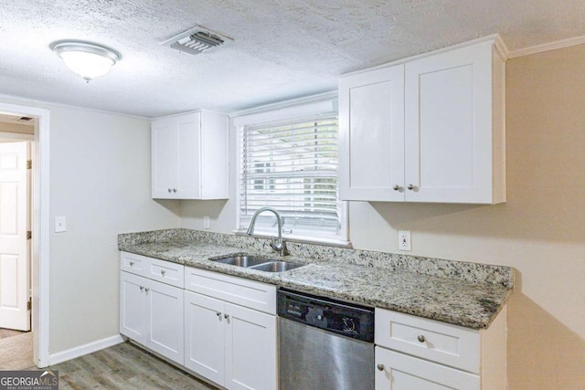 kitchen with light stone counters, sink, white cabinets, dishwasher, and light hardwood / wood-style flooring