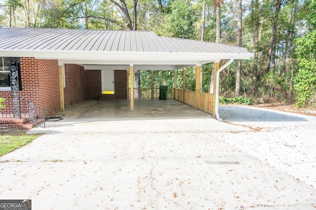 view of vehicle parking with a carport