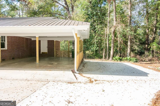 view of vehicle parking featuring a carport