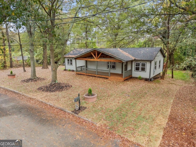 view of front of home with a wooden deck