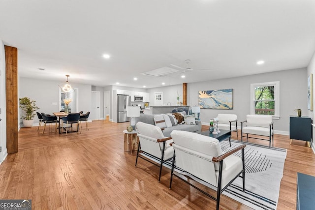 living room with light hardwood / wood-style flooring