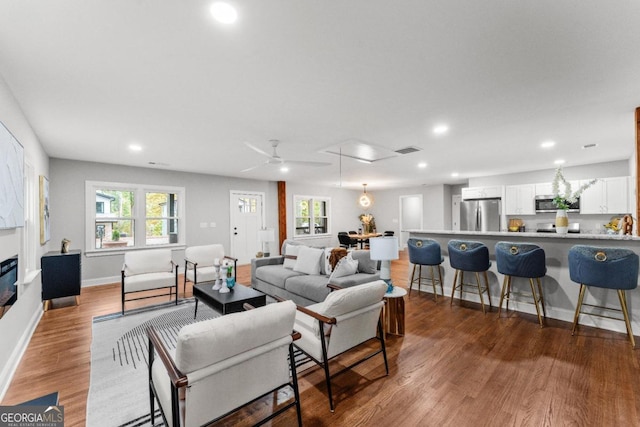 living room with dark hardwood / wood-style flooring