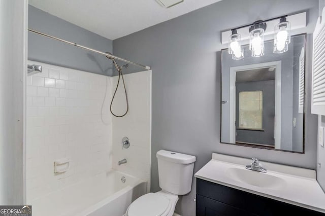 full bathroom featuring vanity, toilet, and tiled shower / bath combo