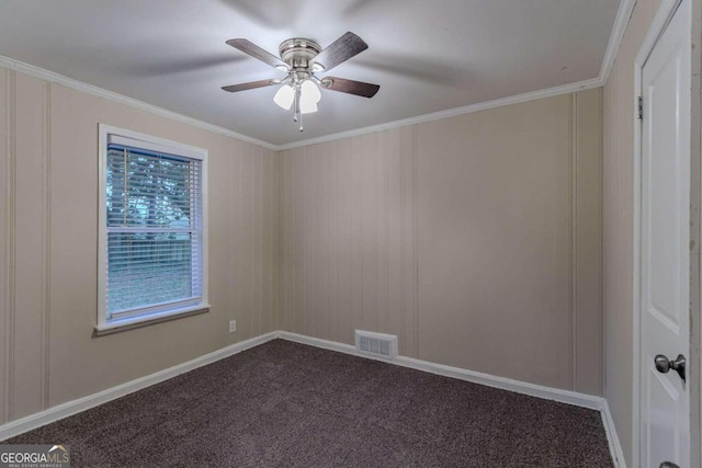 unfurnished room with ornamental molding, carpet, and ceiling fan