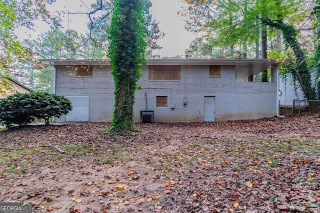 back of property featuring central AC unit