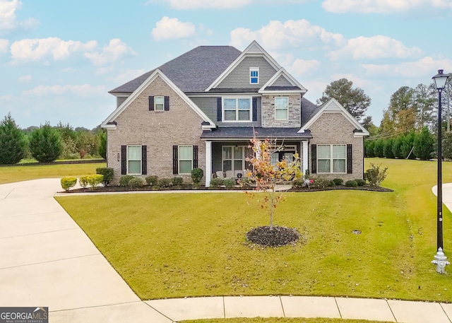 craftsman-style house with a front lawn