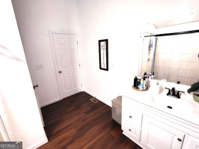 bathroom with vanity and hardwood / wood-style flooring