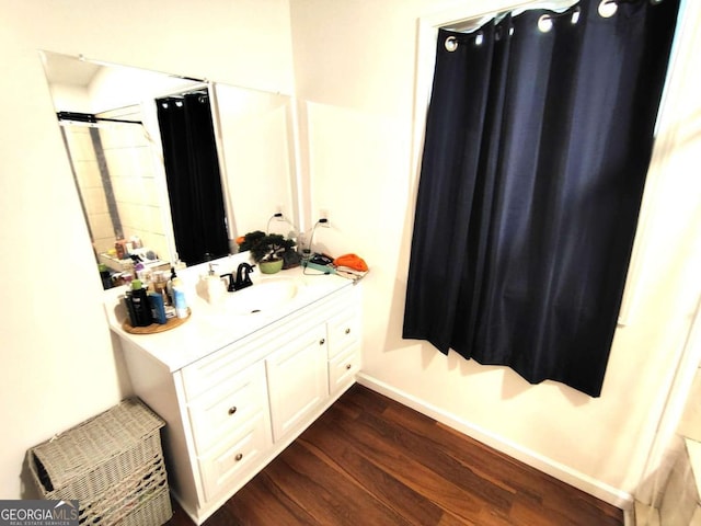 bathroom with vanity and wood-type flooring