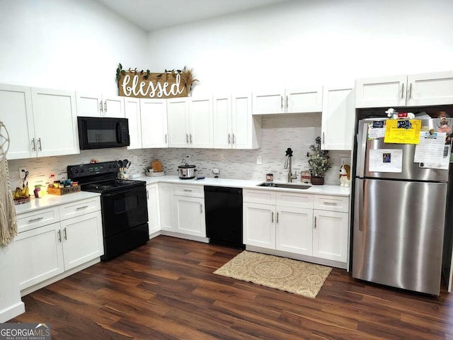 kitchen featuring white cabinetry, sink, black appliances, backsplash, and dark hardwood / wood-style flooring