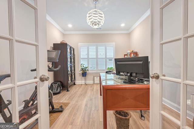 office space featuring ornamental molding, french doors, and light hardwood / wood-style flooring