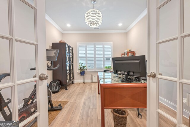 office featuring crown molding, visible vents, baseboards, and light wood-type flooring