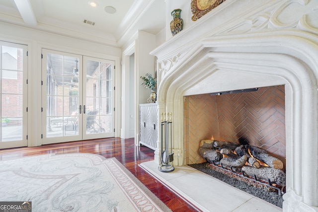 bedroom with french doors, access to exterior, hardwood / wood-style flooring, ornamental molding, and beamed ceiling