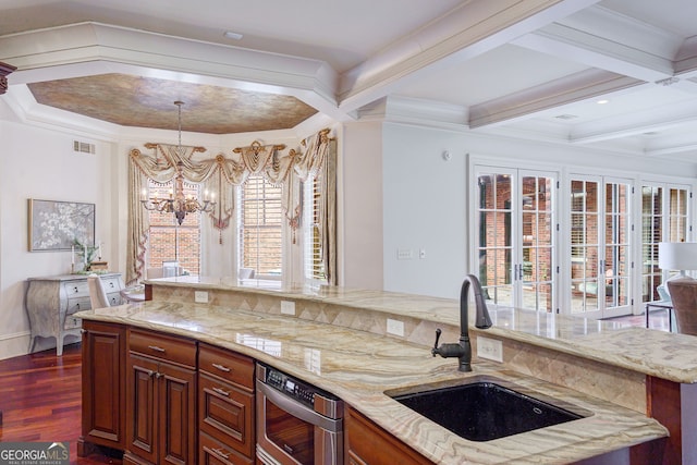 kitchen featuring sink, ornamental molding, a chandelier, coffered ceiling, and dark hardwood / wood-style flooring