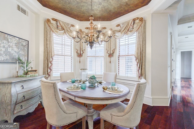 dining space with dark wood-type flooring, a notable chandelier, and ornamental molding