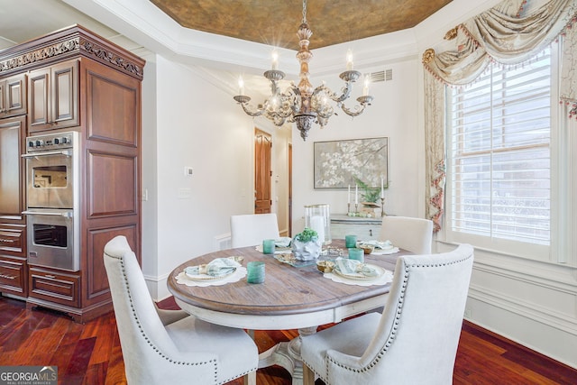 dining space with a wealth of natural light, dark hardwood / wood-style flooring, and crown molding