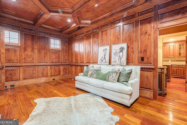 living room with ornamental molding, light hardwood / wood-style floors, wood walls, and wood ceiling