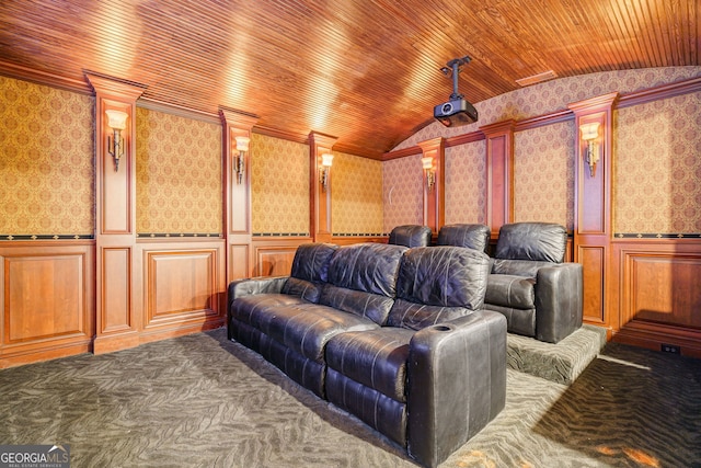 carpeted home theater room with lofted ceiling and wooden ceiling