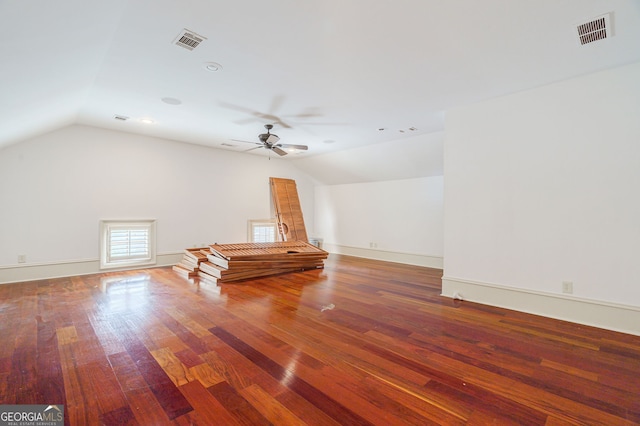 interior space with lofted ceiling, hardwood / wood-style flooring, and ceiling fan