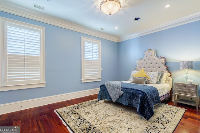 bedroom featuring dark wood-type flooring and crown molding