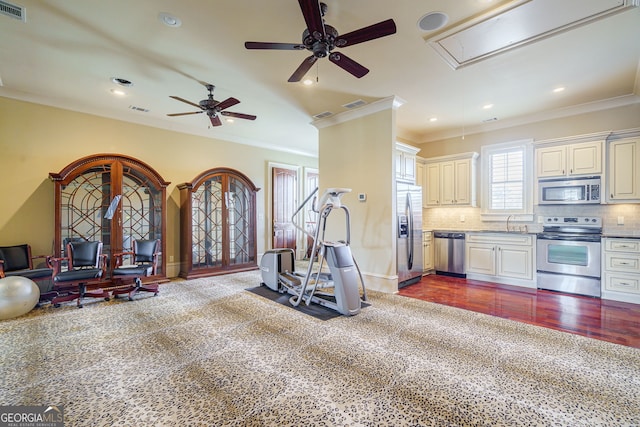 interior space featuring dark wood-type flooring, ceiling fan, crown molding, and sink