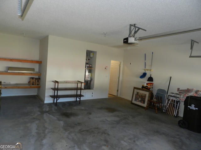 garage with secured water heater and a garage door opener