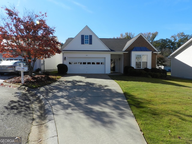 front of property featuring a garage and a front lawn