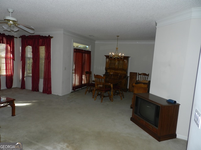 carpeted dining space with ceiling fan with notable chandelier, a wealth of natural light, and a textured ceiling