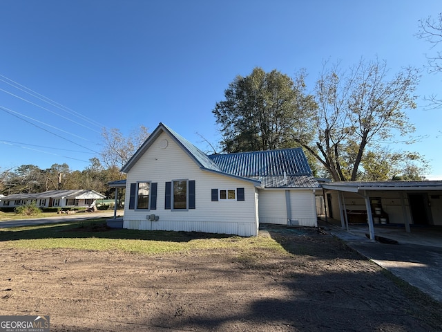 view of property exterior with a carport