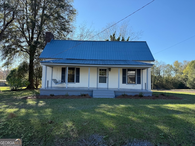 view of front of home featuring a front yard and a porch