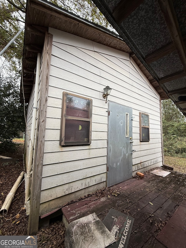 view of property exterior featuring a deck