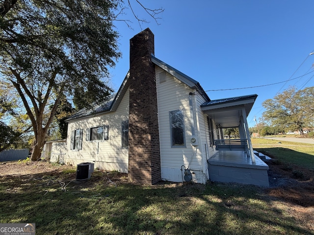 view of home's exterior featuring a lawn