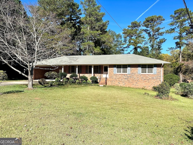 ranch-style house featuring a front lawn