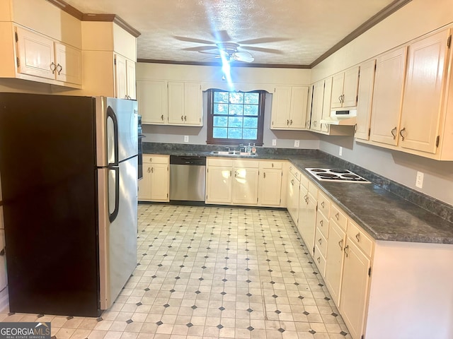 kitchen with sink, appliances with stainless steel finishes, ornamental molding, ceiling fan, and a textured ceiling