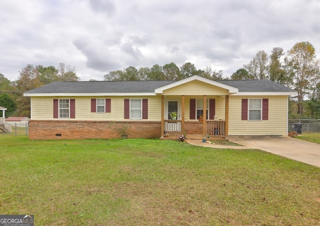 ranch-style home with covered porch and a front lawn