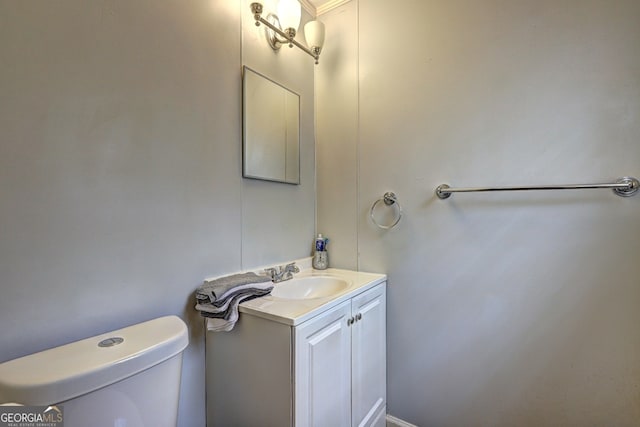 bathroom featuring toilet and vanity