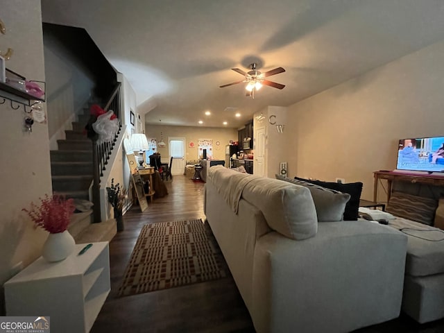 living room featuring hardwood / wood-style flooring and ceiling fan